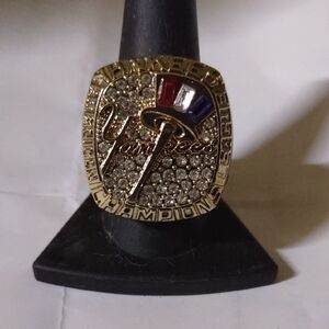 Gold Championship Ring with Red, Blue, and White Accents